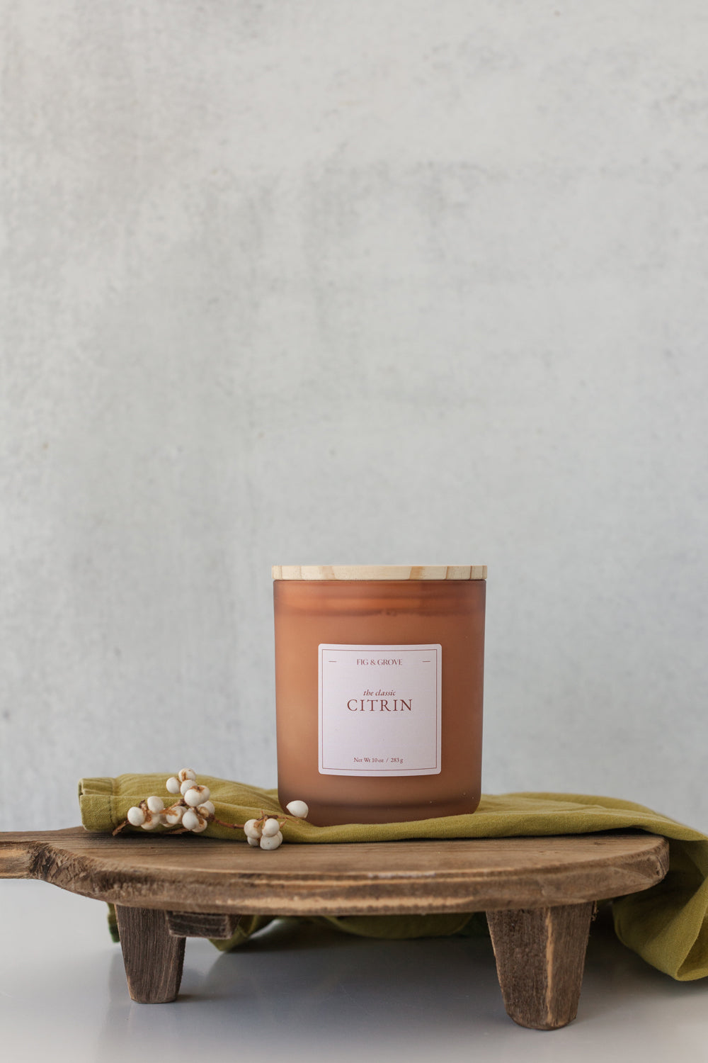 Ginger Lime candle by Fig & Grove, featuring a minimalist label and natural soy wax, with calming scents of ginger and lime essential oils.