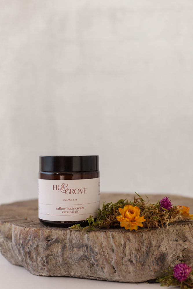 Tallow body cream with essential oils in a 4 oz amber glass jar