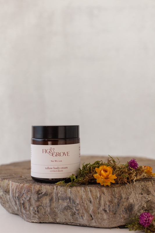 Tallow body cream with essential oils in a 4 oz amber glass jar