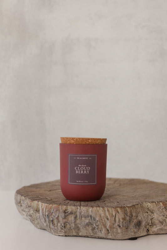 Cloudberry candle in umber glass jar evoking snowy forest freshness – Fig & Grove