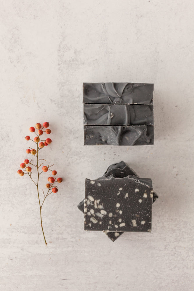 Starry Nights goat milk and tallow soap bar with charcoal base and white speckles resembling stars – Fig & Grove