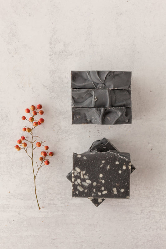 Starry Nights goat milk and tallow soap bar with charcoal base and white speckles resembling stars – Fig & Grove