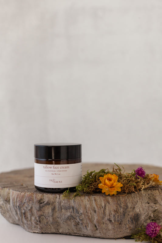 Unscented tallow face cream in a 2 oz amber jar